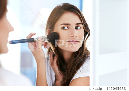Mirror, makeup brush and face of woman with cosmetic facial routine for skin glow at home. Smile, confident and female person with beauty tool for cosmetology treatment in reflection at apartment. 142045488