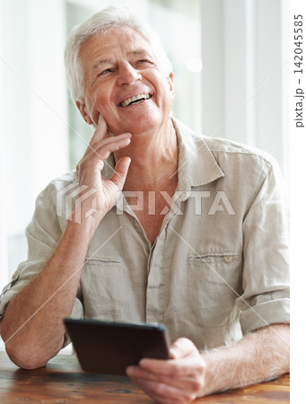 Tablet, senior man and thinking in home, laugh and online website for blog and read. Technology, email or digital or connection for app communication, social media or internet in house living room Tablet, senior man and thinking in home, laugh and online website for blog and read. Technology, email or digital or connection for app communication, social media or internet in house living room 142045585