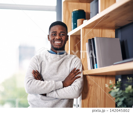 Portrait, black man and confident with smile in office for startup company, junior employee or intern. Happy, person and arms crossed in workspace for entrepreneur, worker and professional consultant Portrait, black man and confident with smile in office for startup company, junior employee or intern. Happy, person and arms crossed in workspace for entrepreneur, worker and professional consultant 142045802