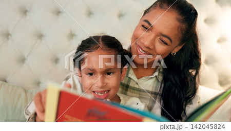 Reading, mother and girl in bedroom with book, teaching and learning in family home and education. Knowledge, fantasy and storytelling, mama or daughter relax on bed together with love, care and calm Reading, mother and girl in bedroom with book, teaching and learning in family home and education. Knowledge, fantasy and storytelling, mama or daughter relax on bed together with love, care and calm 142045824