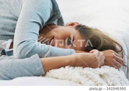 Happy, morning and portrait of woman in bed for relaxing, resting and wake up from sleep in home. Smile, house and face of person in bedroom with blanket on weekend, vacation and break for comfort Happy, morning and portrait of woman in bed for relaxing, resting and wake up from sleep in home. Smile, house and face of person in bedroom with blanket on weekend, vacation and break for comfort 142046360