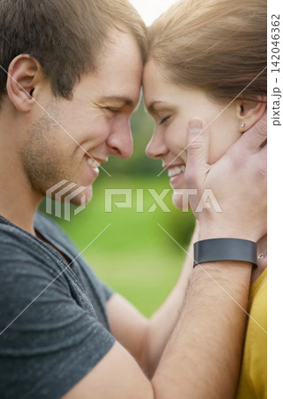 Couple, forehead and hug with love outdoor for passion or care, affection and bonding on weekend getaway or vacation. Man, woman and together for security or safety, romance and happiness in nature. Couple, forehead and hug with love outdoor for passion or care, affection and bonding on weekend getaway or vacation. Man, woman and together for security or safety, romance and happiness in nature. 142046362
