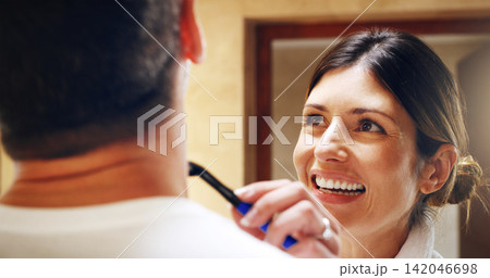 Woman, shave man and grooming in bathroom, wellness and beauty with couple bonding at home with morning routine. Razor, foam and hair removal with happiness, love and support for personal hygiene Woman, shave man and grooming in bathroom, wellness and beauty with couple bonding at home with morning routine. Razor, foam and hair removal with happiness, love and support for personal hygiene 142046698