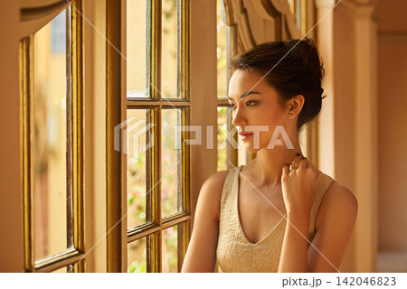 Fashion, thinking and elegant woman by window in style, classy outfit and formal clothes in home. Wealth, aesthetic and person with confidence, pride and luxury in vintage manor, house and mansion Fashion, thinking and elegant woman by window in style, classy outfit and formal clothes in home. Wealth, aesthetic and person with confidence, pride and luxury in vintage manor, house and mansion 142046823
