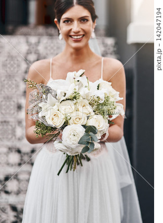 Portrait, woman and smile in wedding dress, flowers and bride for marriage, bouquet and roses. Celebration, ceremony and elegant for commitment, happy female person and romance in love at event Portrait, woman and smile in wedding dress, flowers and bride for marriage, bouquet and roses. Celebration, ceremony and elegant for commitment, happy female person and romance in love at event 142047194