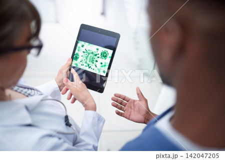Tablet, doctors and people with virus in hospital for medical service, medicine and online research. Healthcare, clinic and man and woman on digital tech for vaccine, wellness website and diagnosis Tablet, doctors and people with virus in hospital for medical service, medicine and online research. Healthcare, clinic and man and woman on digital tech for vaccine, wellness website and diagnosis 142047205