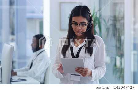 Call center, tablet and woman in office with headset for customer service, research and support. Consultant, company and person with digital technology for communication, telemarketing and networking Call center, tablet and woman in office with headset for customer service, research and support. Consultant, company and person with digital technology for communication, telemarketing and networking 142047427
