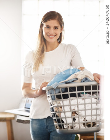 House, portrait and woman with a laundry basket for cleaning with chores, housekeeping and hygiene. Face, female person or cleaner with dirty clothes, apartment and washing fabric with smile in home 142047660