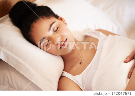 Woman, sleeping and rest in bed for peace, calm and nap to relax in comfortable apartment. Female person, lazy and dream on weekend pillow in home, tired and blanket for fatigue and cozy in bedroom Woman, sleeping and rest in bed for peace, calm and nap to relax in comfortable apartment. Female person, lazy and dream on weekend pillow in home, tired and blanket for fatigue and cozy in bedroom 142047671