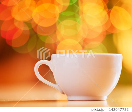Bokeh, background and coffee cup for warm drink, fine china or porcelain with crockery, catering and kitchenware. Color, light and ceramic drinkware with breakfast or break time beverage at cafe Bokeh, background and coffee cup for warm drink, fine china or porcelain with crockery, catering and kitchenware. Color, light and ceramic drinkware with breakfast or break time beverage at cafe 142047722