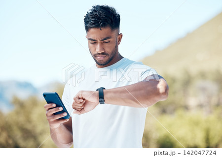 Man, fitness and checking time with watch in nature for tracking performance, steps or workout schedule. Male person, runner or athlete with wristwatch for monitoring heart rate in outdoor exercise 142047724