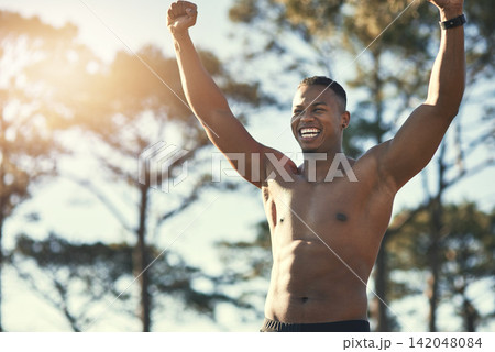 Victory, sports and forest for African man, athlete and nature for workout, training and exercise. Active, energy and person in environment, muscle and wellness for fitness and healthy body outdoor Victory, sports and forest for African man, athlete and nature for workout, training and exercise. Active, energy and person in environment, muscle and wellness for fitness and healthy body outdoor 142048084