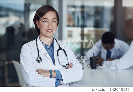 Portrait, woman doctor and hospital for healthcare, physician and medical health staff. Professional, expert and surgeon with stethoscope, female person and cardiologist for research with colleagues 142048143