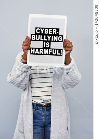 Advertising, screen and woman with tablet in studio for social media, cyberbullying or activism. Digital poster, banner and person with tech for online safety, security and privacy on gray background 142048309