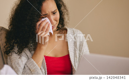 Crying, sad and woman with movie on laptop for watching videos, entertainment and streaming subscription. Home, depression and person on computer with tissue for film on weekend in living room Crying, sad and woman with movie on laptop for watching videos, entertainment and streaming subscription. Home, depression and person on computer with tissue for film on weekend in living room 142048341