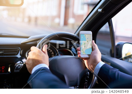 Driving, map and phone with business person in car to search for directions to location for commute. Hands, navigation and traffic with corporate employee in vehicle for travel to destination Driving, map and phone with business person in car to search for directions to location for commute. Hands, navigation and traffic with corporate employee in vehicle for travel to destination 142048549