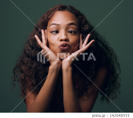 Woman, silly and face with goofy expression for funny joke, humor or comedy on a dark studio background. Young female person, brunette or quirky model with crazy pout, playful mind or fun attitude Woman, silly and face with goofy expression for funny joke, humor or comedy on a dark studio background. Young female person, brunette or quirky model with crazy pout, playful mind or fun attitude 142048555