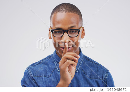 Portrait, glasses and shush with quiet black man in studio isolated on gray background for mystery. Face, finger on lips and secret with emoji hand gesture of private person to whisper in eyewear Portrait, glasses and shush with quiet black man in studio isolated on gray background for mystery. Face, finger on lips and secret with emoji hand gesture of private person to whisper in eyewear 142048672