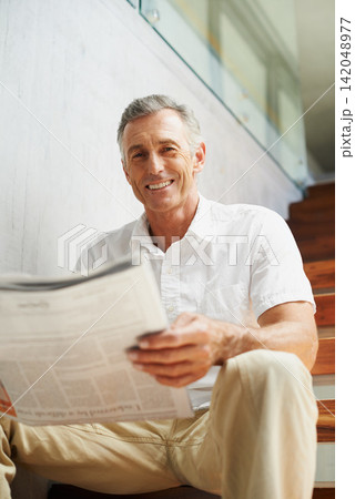Mature, man and portrait with newspaper in office for stock market review for global news, journalist or investment. Male person, face and business section on stairs for financial, report or press Mature, man and portrait with newspaper in office for stock market review for global news, journalist or investment. Male person, face and business section on stairs for financial, report or press 142048977