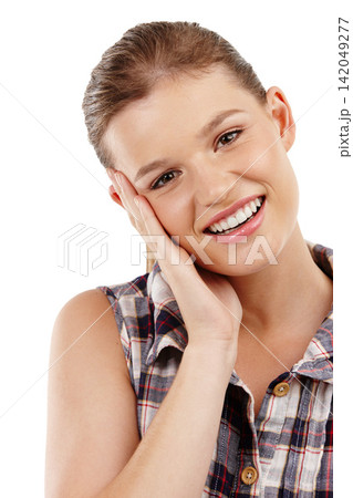 Fashion, portrait and shy girl in studio with stylish, trendy clothes and flannel shirt on white background. Smile, aesthetic and embarrassed gen z person for happiness, hand on face or plaid outfit 142049277