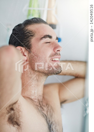 Shower, smile and water for body, man and splash on face, morning and washing in apartment for hygiene. Bathroom, liquid and person with muscle, grooming and cleaning or bath for skincare in home Shower, smile and water for body, man and splash on face, morning and washing in apartment for hygiene. Bathroom, liquid and person with muscle, grooming and cleaning or bath for skincare in home 142049516