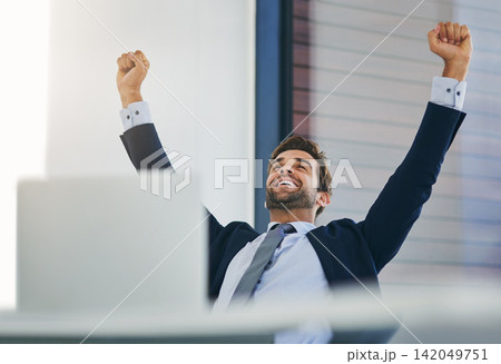 Businessman, winner and success fist in office for celebration, promotion and achievement of goal. Male person or salesman and deal or target with smile, hands up and computer with good news Businessman, winner and success fist in office for celebration, promotion and achievement of goal. Male person or salesman and deal or target with smile, hands up and computer with good news 142049751