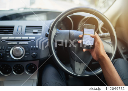 Phone, texting and driving with hands of person on steering wheel with scroll, danger and risk. Road safety, awareness and driver in car with smartphone, distraction and attention with auto insurance Phone, texting and driving with hands of person on steering wheel with scroll, danger and risk. Road safety, awareness and driver in car with smartphone, distraction and attention with auto insurance 142049781