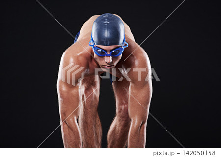Studio, sports and athlete ready to dive for marathon, competition and cardio exercise for workout. Fitness, swimmer and man with start pose for swimming and training on black background Studio, sports and athlete ready to dive for marathon, competition and cardio exercise for workout. Fitness, swimmer and man with start pose for swimming and training on black background 142050158