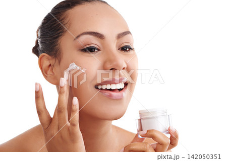 Happy woman, skincare and container with cream for facial or moisturizing on a white studio background. Face of female person, brunette or model with smile for beauty, lotion or SPF in dermatology Happy woman, skincare and container with cream for facial or moisturizing on a white studio background. Face of female person, brunette or model with smile for beauty, lotion or SPF in dermatology 142050351