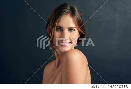 Woman, topless and portrait in studio for skincare, body positivity and acceptance on dark background. Young person, smile and natural beauty for smooth aesthetic and fresh for confidence and happy Woman, topless and portrait in studio for skincare, body positivity and acceptance on dark background. Young person, smile and natural beauty for smooth aesthetic and fresh for confidence and happy 142050518