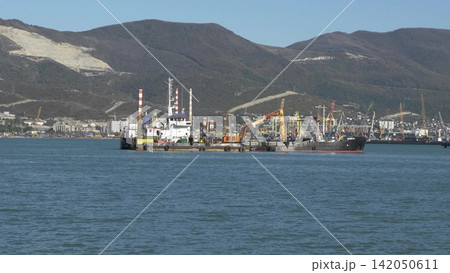 Novorossiysk Russia June 23 2026 Working vessel Pelikan operating in the commercial seaport of Novorossiysk on a sunny day Novorossiysk Russia June 23 2026 Working vessel Pelikan operating in the commercial seaport of Novorossiysk on a sunny day 142050611