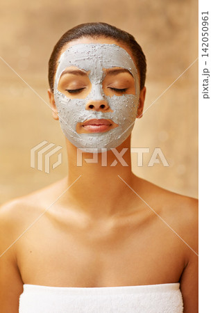 Woman, beauty and mud mask at spa, facial treatment and detox or cleaning dermatology. Female person, self care and chemical peeling or skincare to pamper, cosmetics and exfoliate clay for acne Woman, beauty and mud mask at spa, facial treatment and detox or cleaning dermatology. Female person, self care and chemical peeling or skincare to pamper, cosmetics and exfoliate clay for acne 142050961