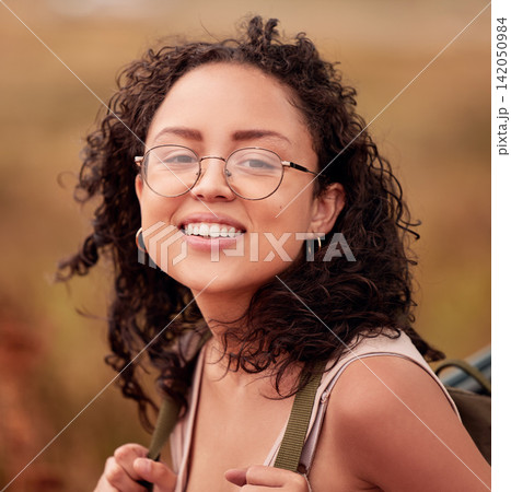 Woman, hiking and portrait with smile for journey, peace and outdoors adventure for exercise. Female person, face and happiness for fitness, wellness and mindset with backpack on summer walk Woman, hiking and portrait with smile for journey, peace and outdoors adventure for exercise. Female person, face and happiness for fitness, wellness and mindset with backpack on summer walk 142050984