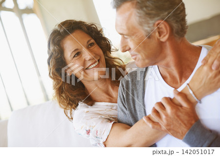 Mature, couple and smile hug in home living room for relationship connection, retirement or relaxing. Man, woman and embrace in apartment with happiness with marriage commitment, love or together Mature, couple and smile hug in home living room for relationship connection, retirement or relaxing. Man, woman and embrace in apartment with happiness with marriage commitment, love or together 142051017