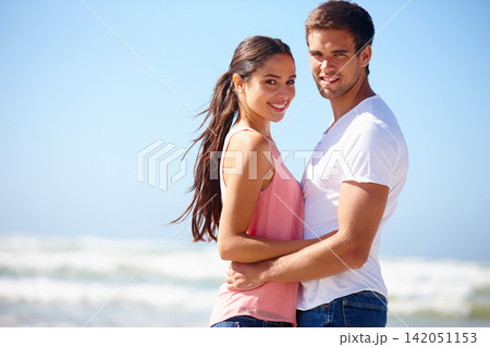 Happy couple, portrait and beach with hug in relax for bonding, love or embrace on outdoor holiday in nature. Young man and woman enjoying weekend for relationship together by ocean on mockup space Happy couple, portrait and beach with hug in relax for bonding, love or embrace on outdoor holiday in nature. Young man and woman enjoying weekend for relationship together by ocean on mockup space 142051153