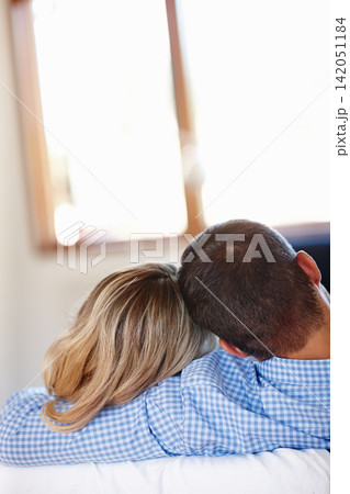 Couple, hugging and love in house with couch for romance, sitting together and peaceful bonding. Man, woman and relaxing in living room with happiness for romantic time, comforting and rear view Couple, hugging and love in house with couch for romance, sitting together and peaceful bonding. Man, woman and relaxing in living room with happiness for romantic time, comforting and rear view 142051184