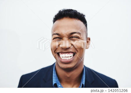 Happy, face and businessman laughing in studio with funny, teeth and feel good mood, confidence or personality on white background. Comic, silly and African model smile for goofy joke or comedy 142051206