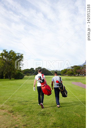 Sports, golf and men on grass walking for game, match and competition on golfing course. Recreation, hobby and athlete friends with club driver on field for training, fitness and practice outdoors 142051288