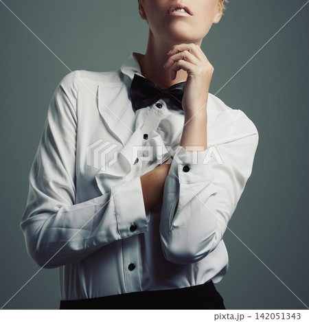 Woman, studio and elegant bowtie for fashion, grey background and isolated female person in waiter clothes for job. Trendy, designer shirt with copy space for stylish model, professional adult Woman, studio and elegant bowtie for fashion, grey background and isolated female person in waiter clothes for job. Trendy, designer shirt with copy space for stylish model, professional adult 142051343