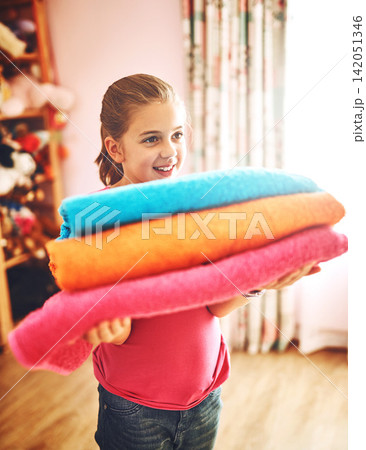 Girl, child and home or laundry for housework, learning and development or cleaning. Kid, job or happy with colorful washing in living room, help or support with clothes for family or mother Girl, child and home or laundry for housework, learning and development or cleaning. Kid, job or happy with colorful washing in living room, help or support with clothes for family or mother 142051346