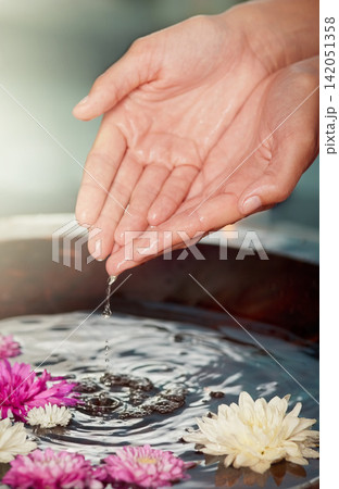 Water, flowers and hands at spa for skincare, wellness or relax at sustainable luxury salon. Finger, nail or organic bowl closeup for clean, beauty or person in healthy natural treatment for manicure Water, flowers and hands at spa for skincare, wellness or relax at sustainable luxury salon. Finger, nail or organic bowl closeup for clean, beauty or person in healthy natural treatment for manicure 142051358