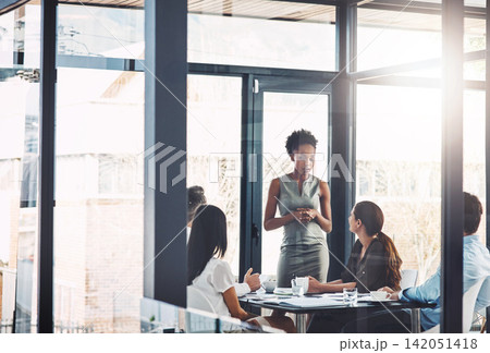 Business people, window and communication in office with meeting for brainstorming, strategy or idea. Corporate, diversity and team with training at work for project management, growth and leadership Business people, window and communication in office with meeting for brainstorming, strategy or idea. Corporate, diversity and team with training at work for project management, growth and leadership 142051418