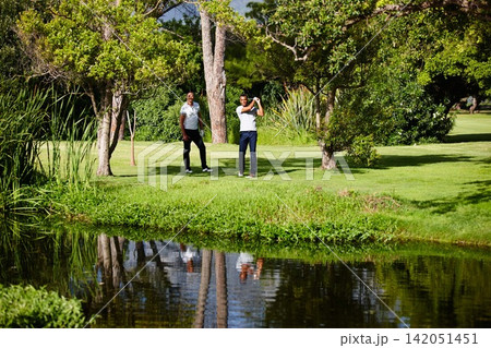 Summer, sport and people on course for golf game or practice together at club in nature. Friends, training and playing on grass on luxury holiday or vacation in countryside with exercise or challenge Summer, sport and people on course for golf game or practice together at club in nature. Friends, training and playing on grass on luxury holiday or vacation in countryside with exercise or challenge 142051451