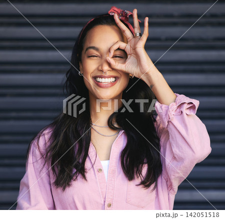 Woman, portrait and ok gesture over eye, fun and playful with POV or lens for humor on dark background. Hand, vision or perspective with happy young model, silly or quirky for like emoji or sign Woman, portrait and ok gesture over eye, fun and playful with POV or lens for humor on dark background. Hand, vision or perspective with happy young model, silly or quirky for like emoji or sign 142051518