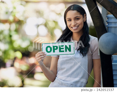 Woman, smile and open sign at nursery with small business, gardening and sustainability with welcome. Poster, notice and portrait of flower seller with retail, florist or entrepreneur with service 142051537