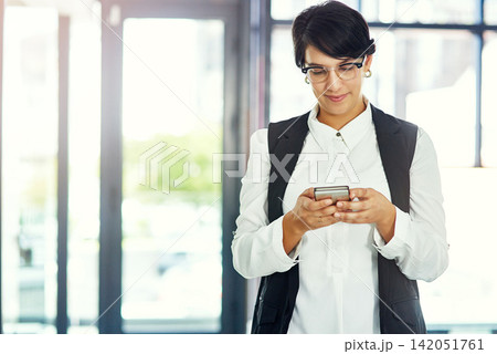 Office, business and woman and typing on smartphone, web search and internet browsing or mobile connection. Communication, technology and smile online or happy for notification, text and professional Office, business and woman and typing on smartphone, web search and internet browsing or mobile connection. Communication, technology and smile online or happy for notification, text and professional 142051761