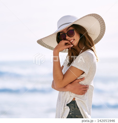 Sunglasses, smile and portrait of woman at beach for summer vacation, travel and adventure in Miami. Outdoor, happy and relax by ocean with hat for tourism, weekend trip and confidence on holiday 142051946
