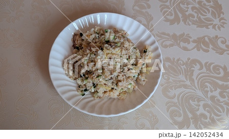 Homemade rice dish with canned mackerel and ginger Homemade rice dish with canned mackerel and ginger 142052434
