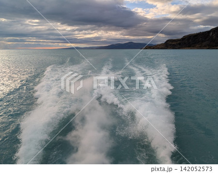 Tour Boat Wake Across Lago Argentino Under Cloudy Sky Tour Boat Wake Across Lago Argentino Under Cloudy Sky 142052573