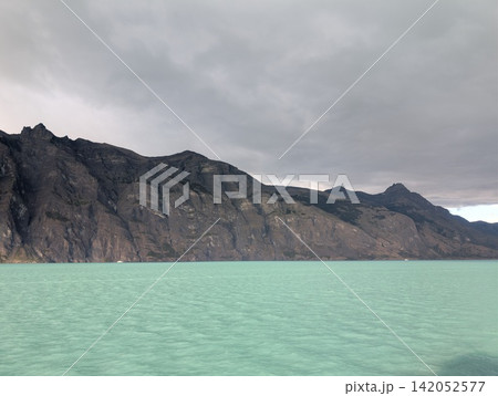 Rugged Patagonian Mountains Beside Turquoise Glacial Lake Rugged Patagonian Mountains Beside Turquoise Glacial Lake 142052577